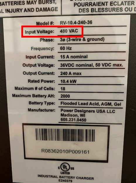 A charger data plate with the input voltage highlighted