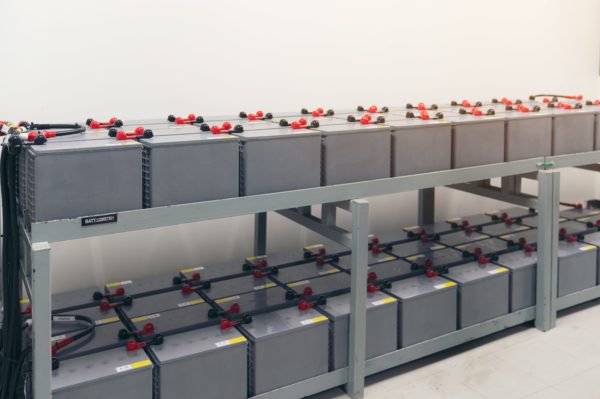 battery-storage A bank of batteries being stored on metal shelving