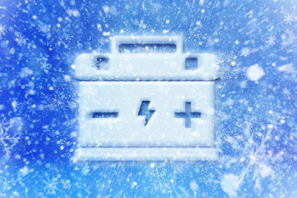 An illustrated battery shown surrounded by ice and snow