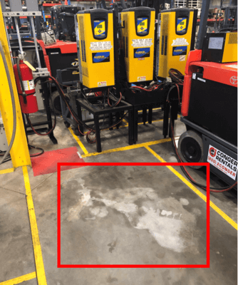 spilled-battery-acid-on-floor Corroded concrete due to battery acid spillage
