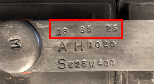 The model number of a forklift battery stamped on the intercell connector