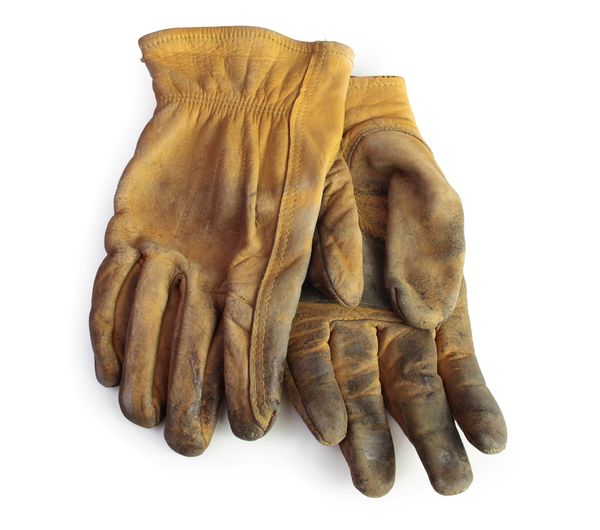 dirty-leather-yellow-pair-work-gloves A pair of dirty rubber gloves